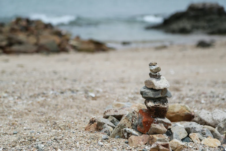 the rock tower is placed on the shore