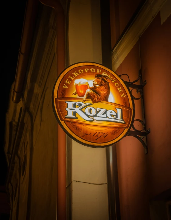 a large yellow and brown beer sign that reads rozeel