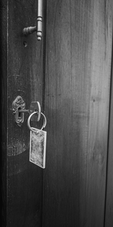 black and white po of a key on the door