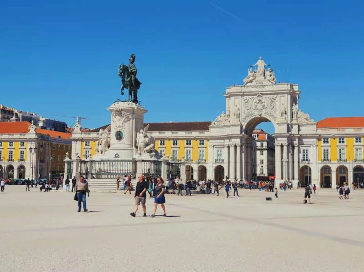 a large building with some people standing around it