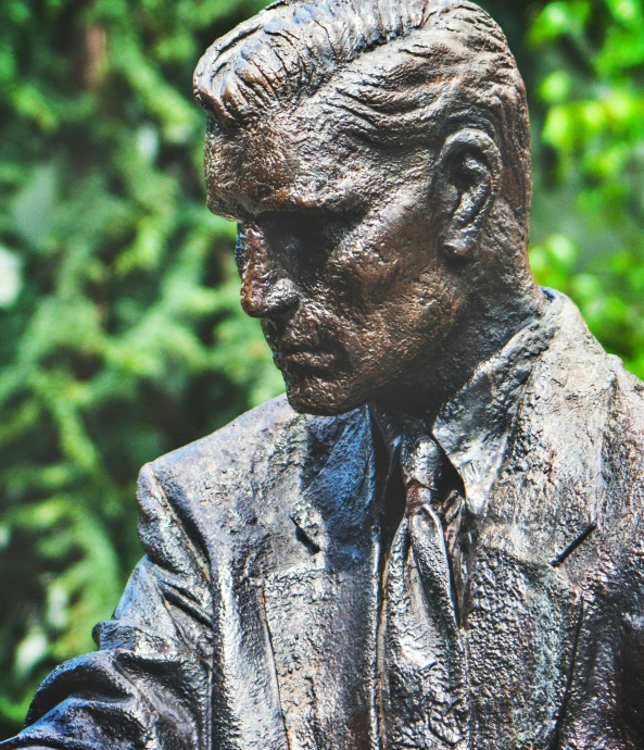 statue of a man dressed in suit and tie