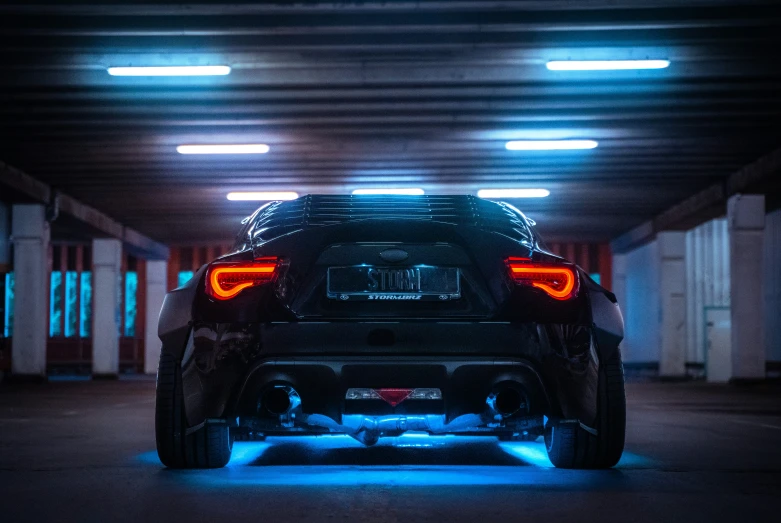 car in parking garage with blue light