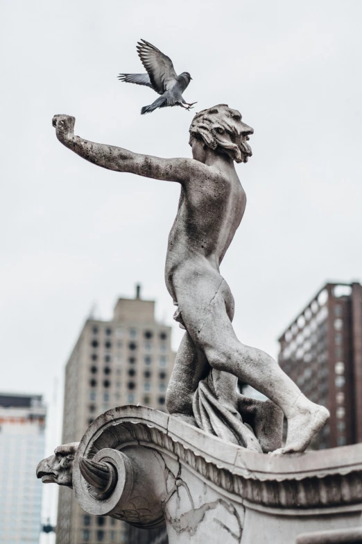 a statue that is next to some kind of building