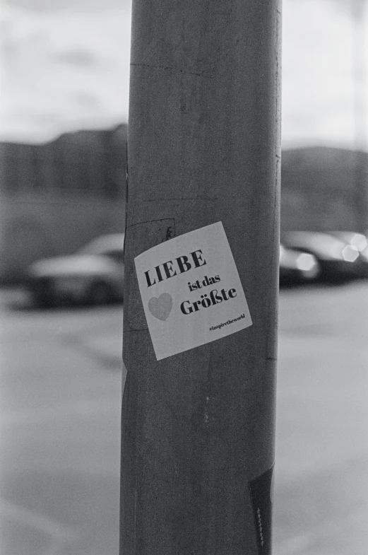 a black and white po of the back end of a parking meter