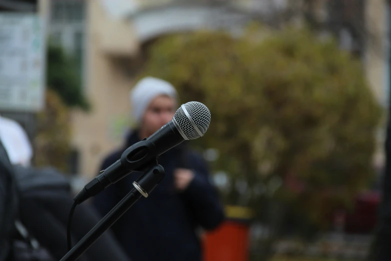 the microphone is shown in front of people