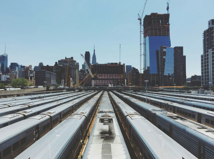 a train yard and many trains in the city