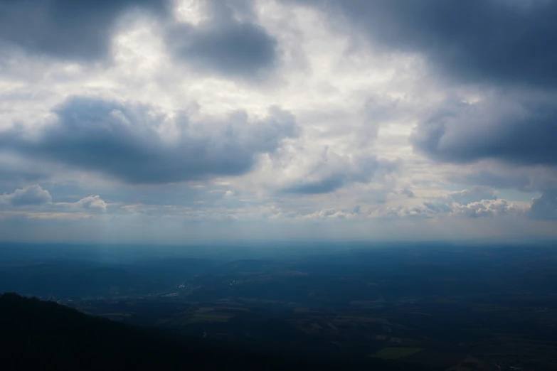 a view from the top of a mountain with a bird on it