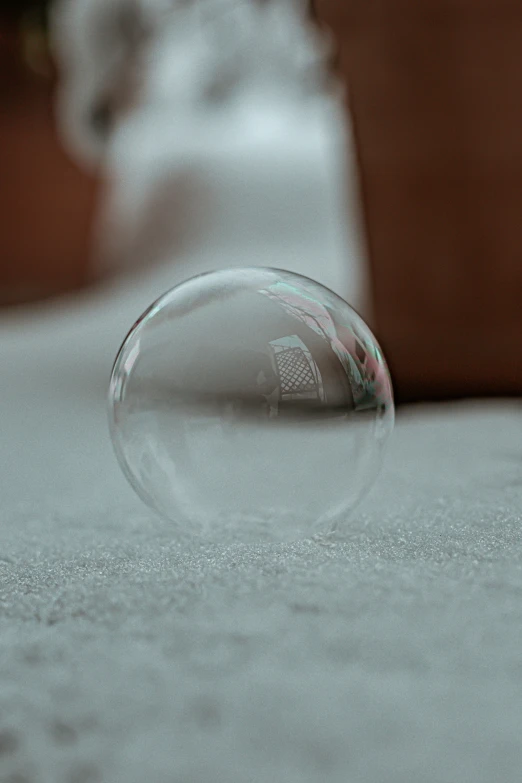 a glass marble laying on a table