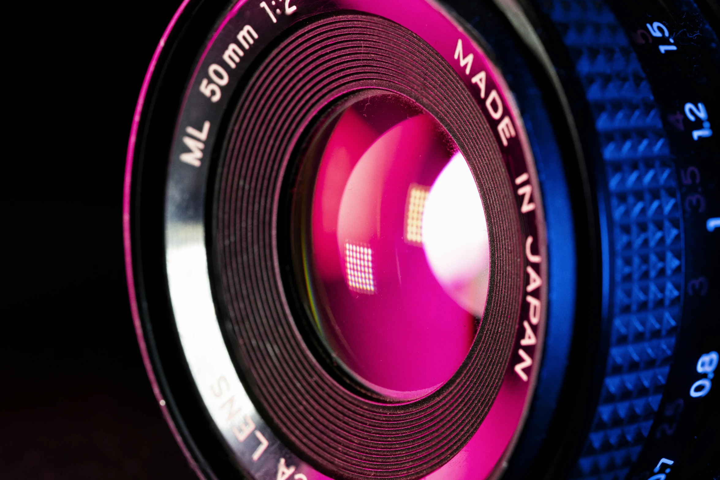 a close up view of an illuminated lens