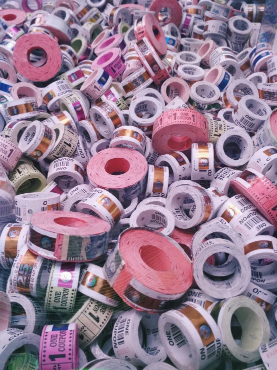 various colored and made tape are piled in rows