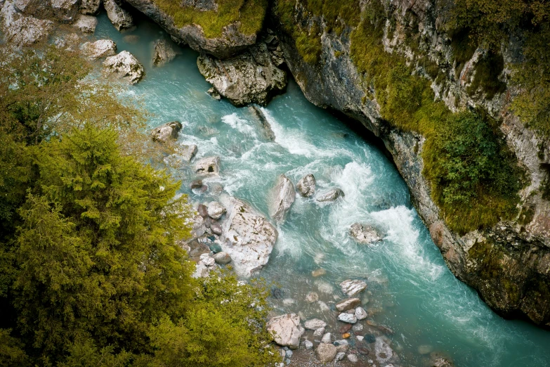 an aerial view of a mountain stream