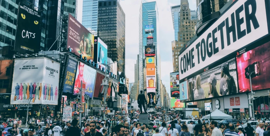 a crowded street with a lot of billboards