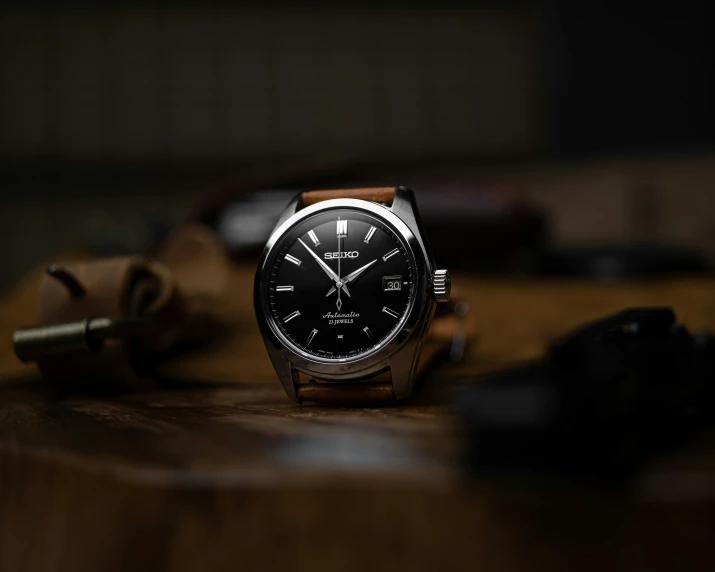 a close up of a watch on a table