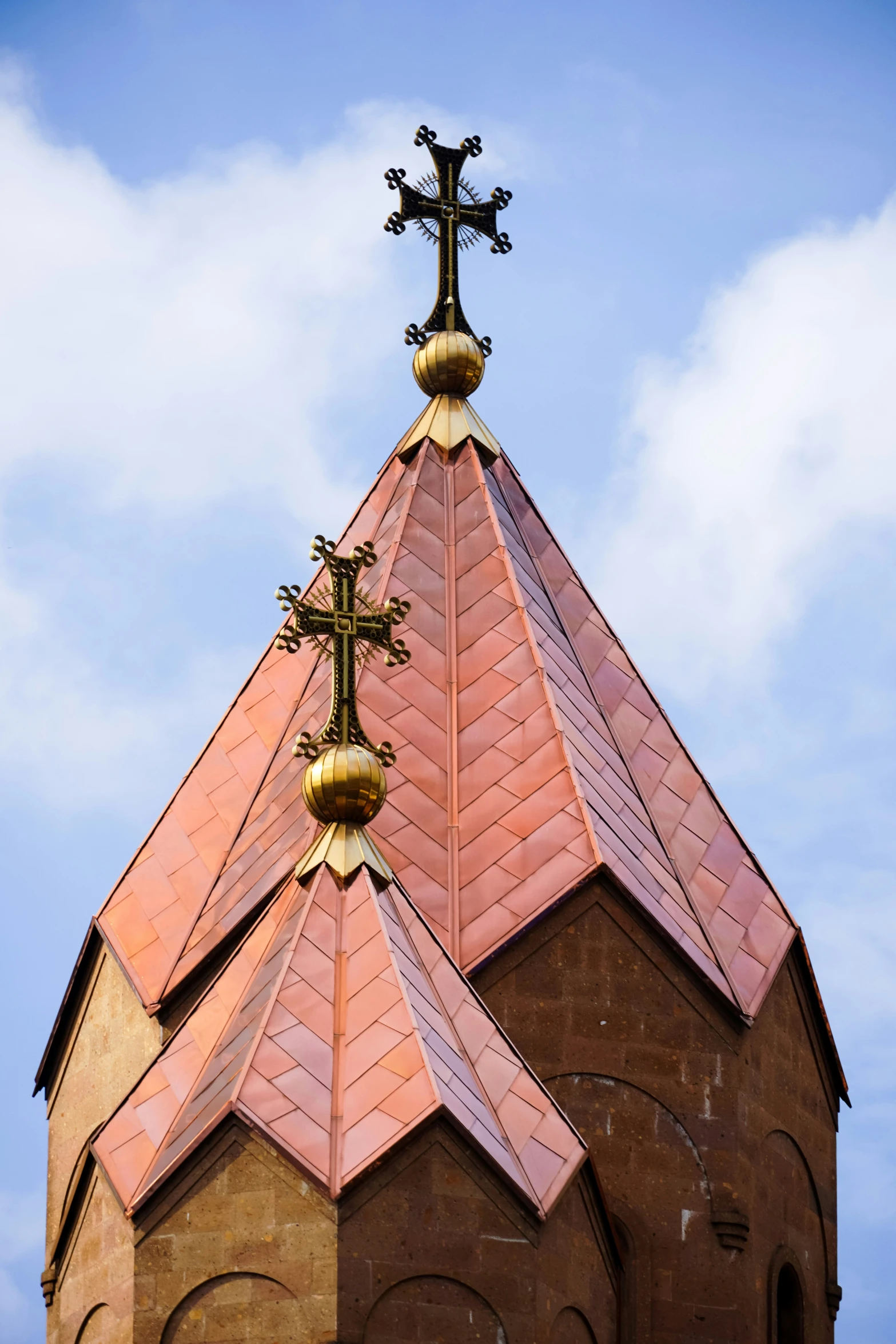 the tops of two towers are decorated with ornate decorations
