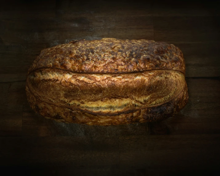 a loaf of bread is sitting on top of a wooden surface