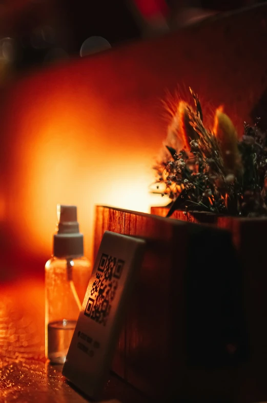 a glass jar and thermos sitting on a wooden counter