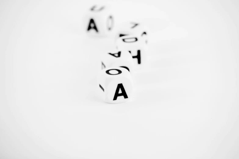four dice spelling love written with black ink