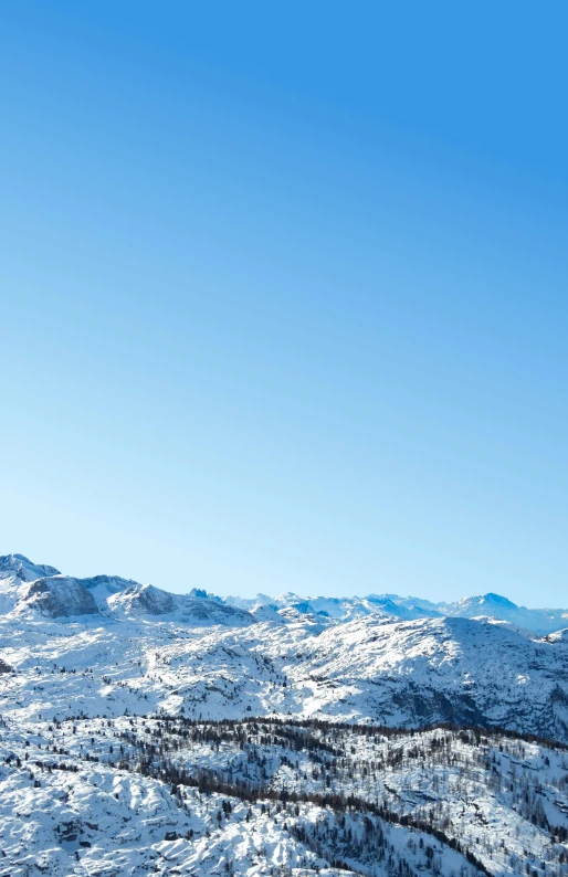 mountains covered in snow under a clear blue sky