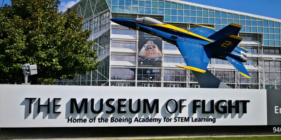 an air show plane display in front of the museum of flight