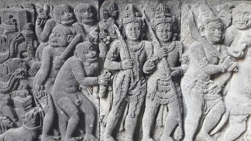 two ancient stone sculptures depicting various times of the day