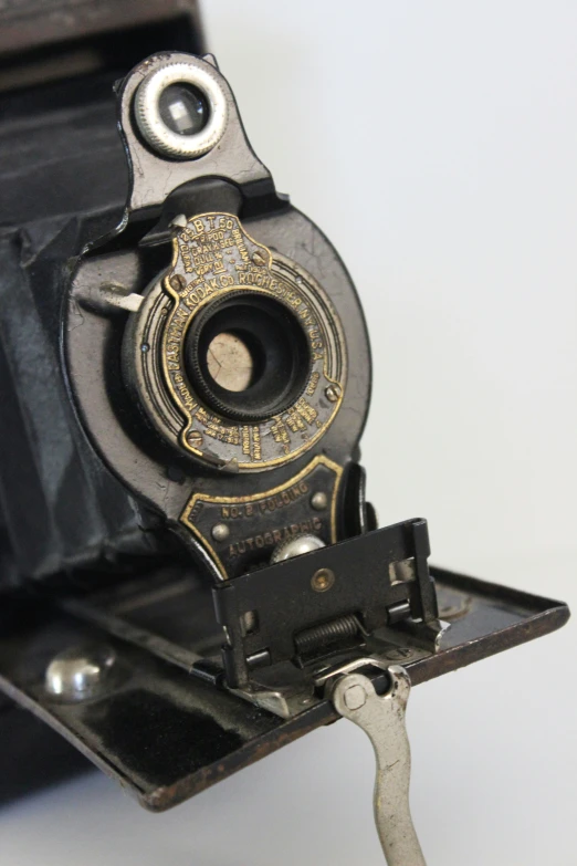 an antique style camera sits on the table