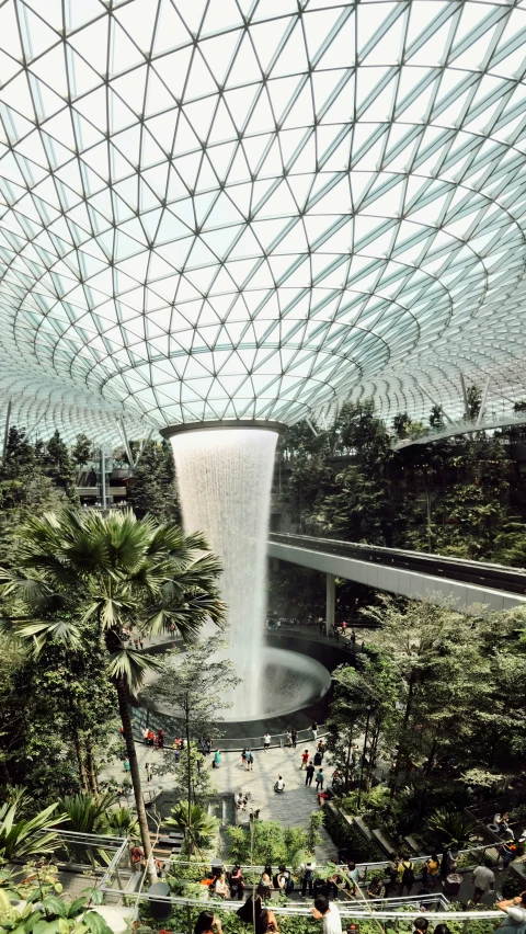 a view from an observation platform over a garden with fountains