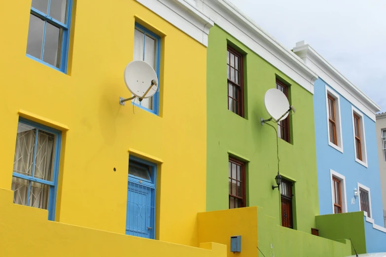 an assortment of colorful buildings in different colors