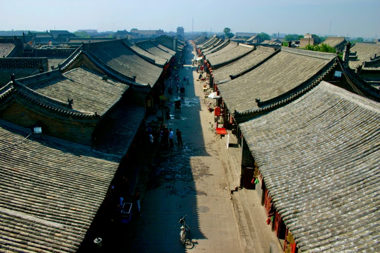 an aerial view of roofs with several pavilions on the roof