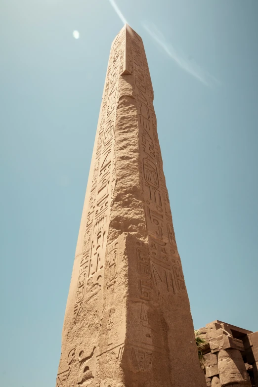 an obelisk that has some writing on it