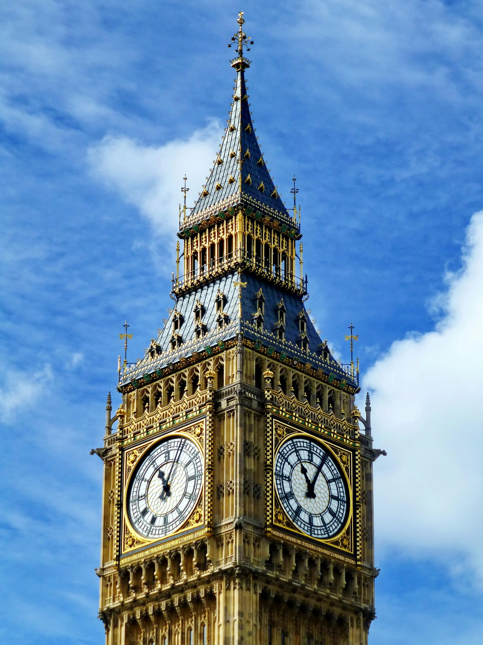 the tower is made of marble with two large clocks on each side