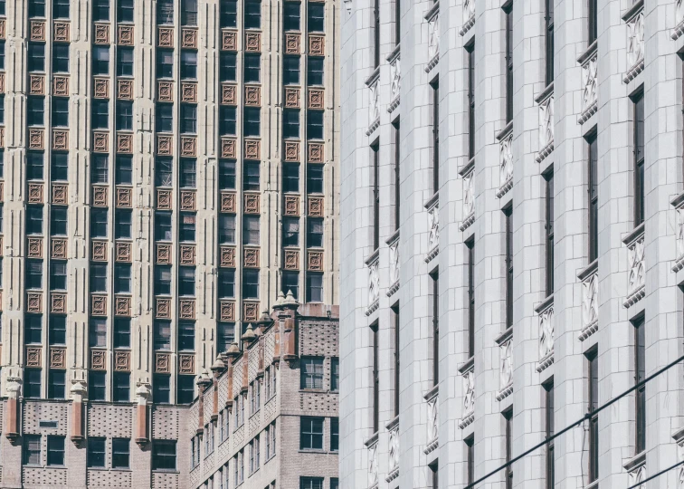 the buildings have many windows and are tall