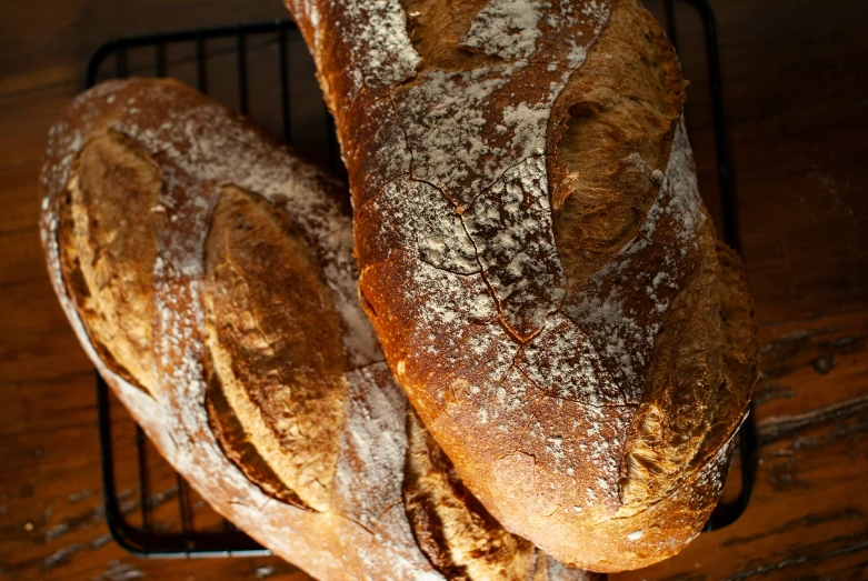 a close up of two large bread loaves