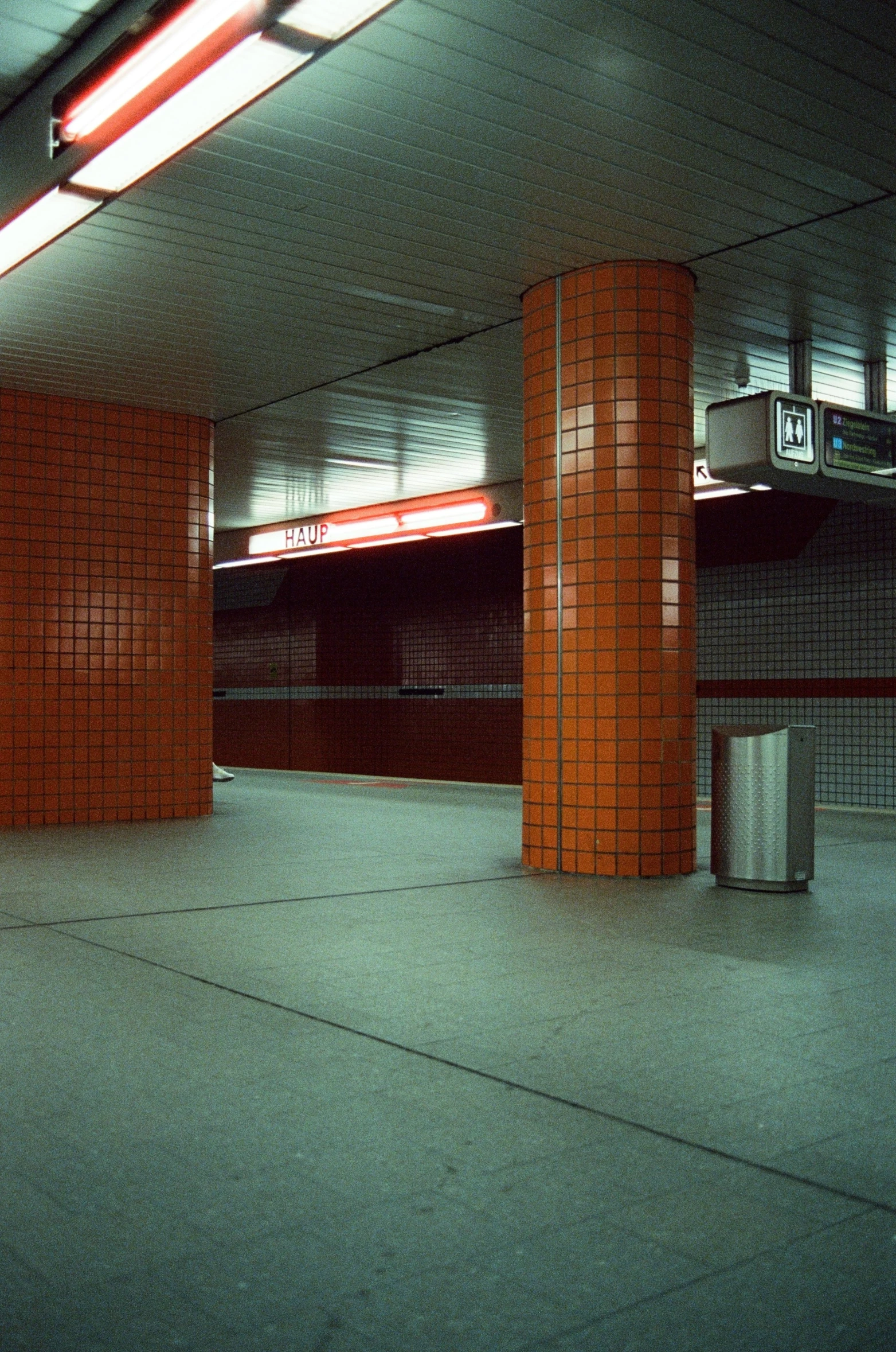 the interior of a brick parking garage with lights