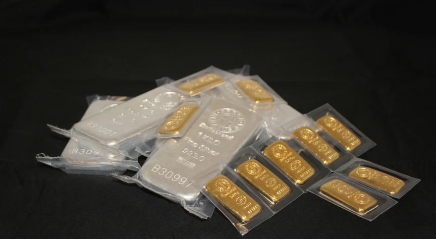 a pack of four gold bars wrapped in plastic