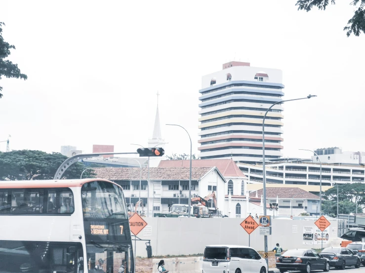 a double decker bus is driving down the road