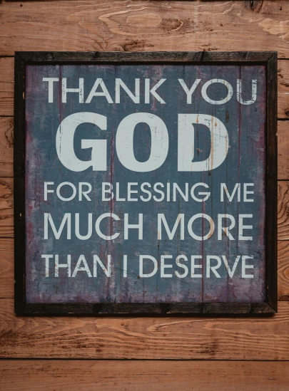 a small wooden plaque with a message and the words thank you god for blessing me much more than i deserves