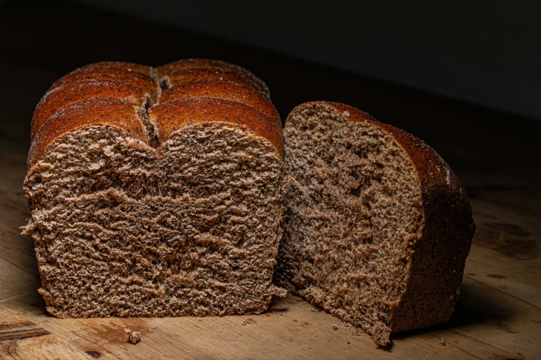 sliced loaf of bread on a wooden  board