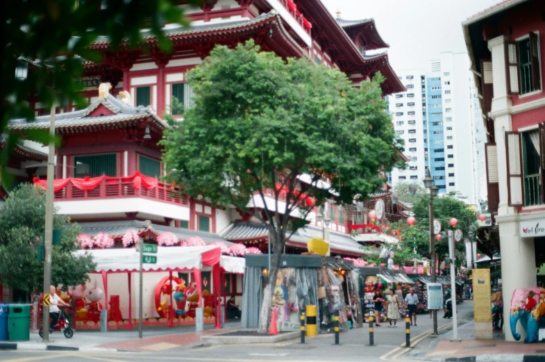 red asian building, with many people around it