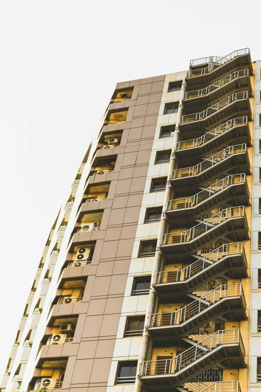 the side of an apartment building with many balconies