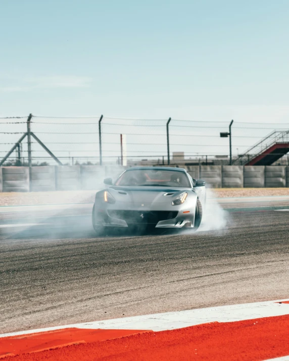 a car going fast in a race during the day