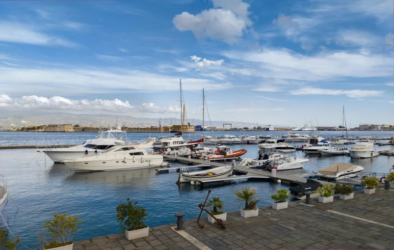 boats docked on a river next to each other