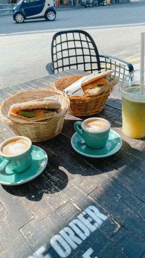 a cup with  beverages sitting on a table