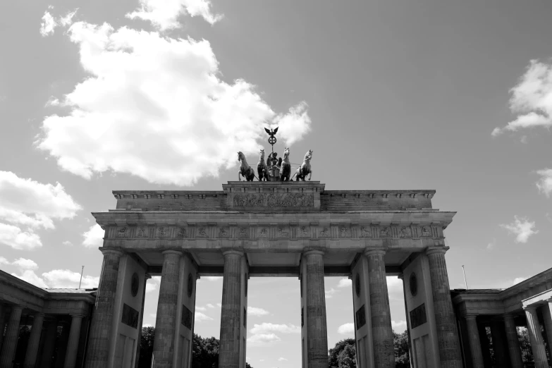 a very tall monument with a cloudy sky in the background