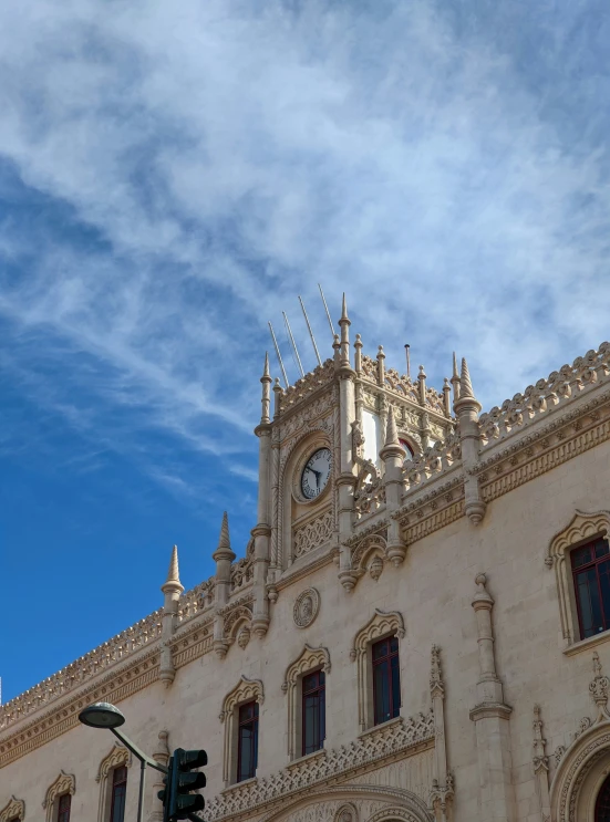 the side of a building has clock displayed on it