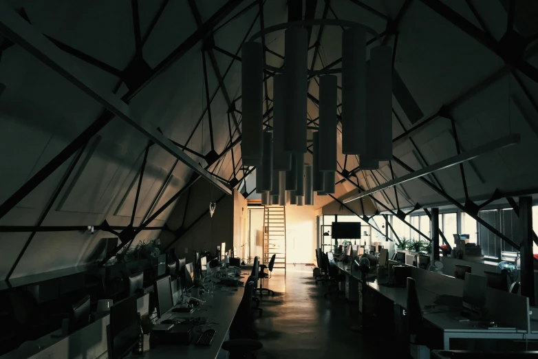 a view of a room with many tables and chairs