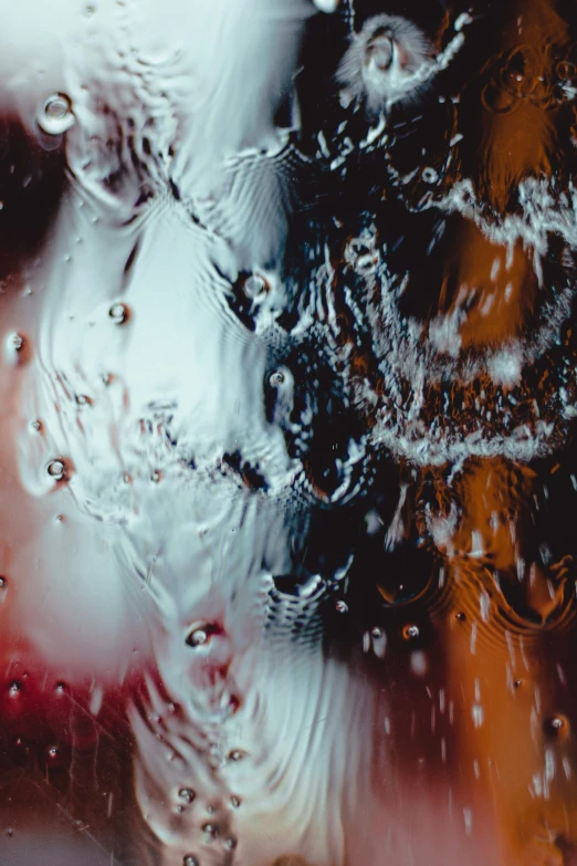 a textured background with drops of water on it