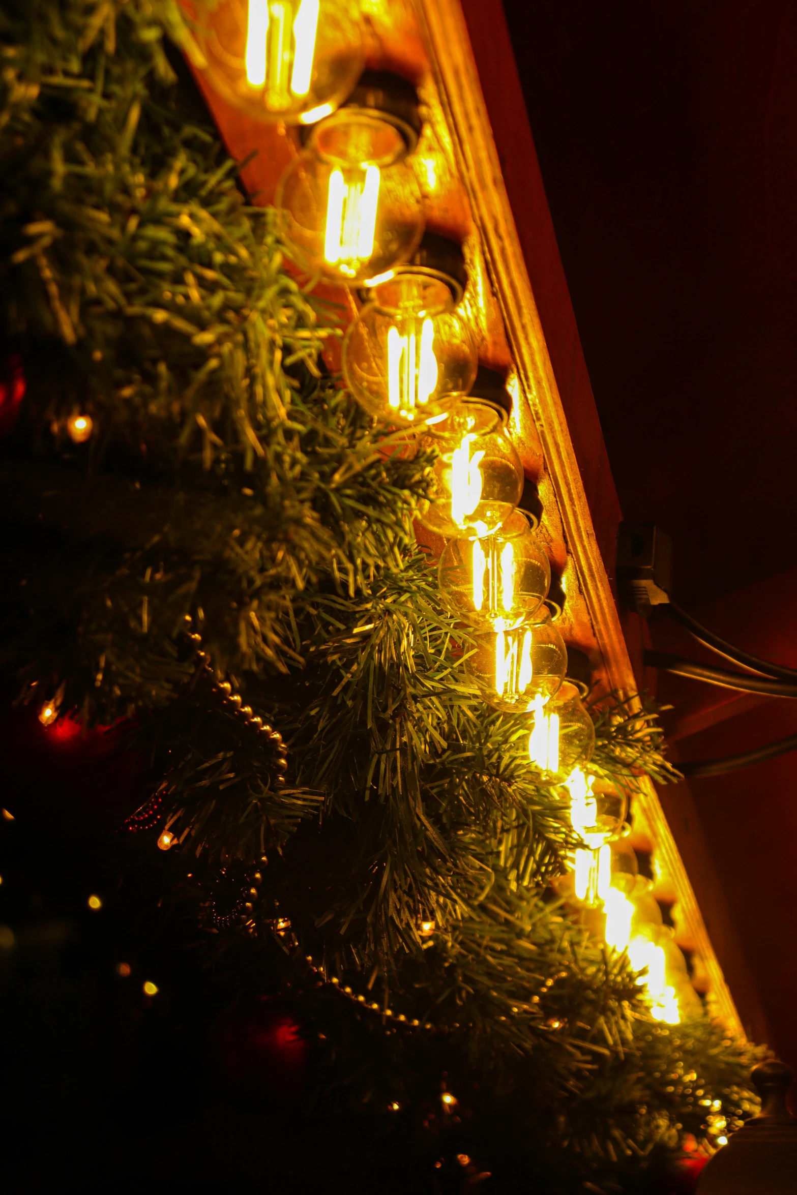 a large number of lights on a wall above trees