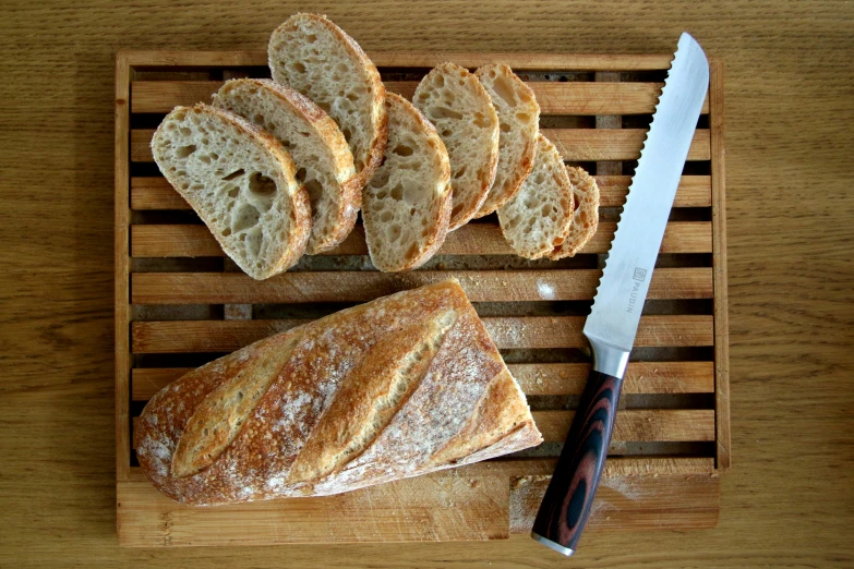 a  board with sliced pieces of bread on it