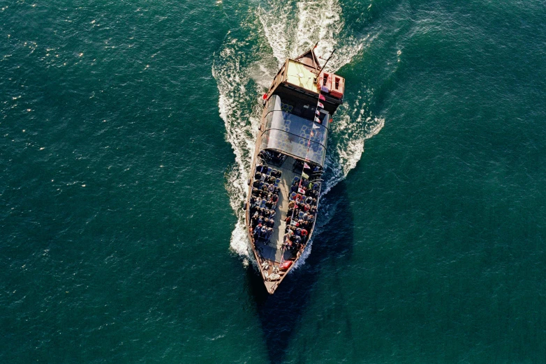 an aerial view of a boat on the ocean