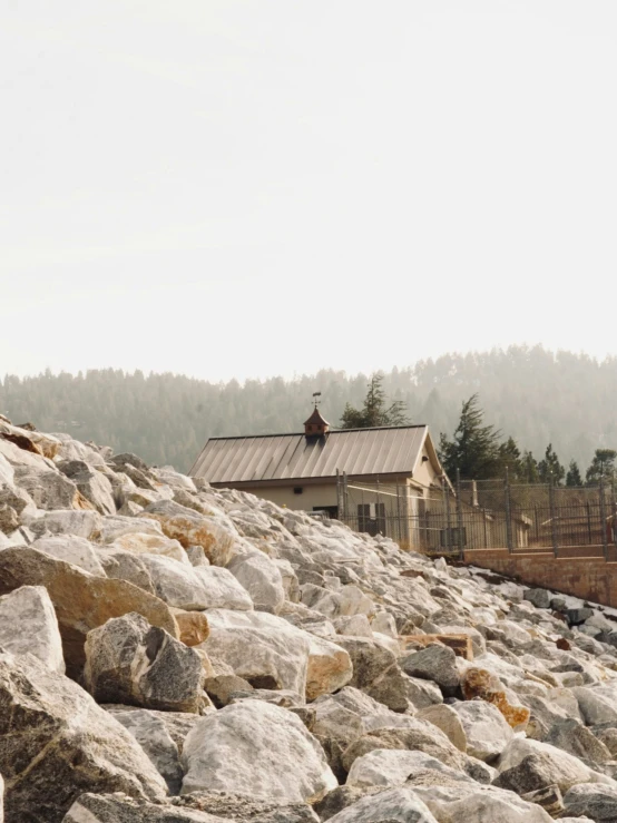 a house that has rocks in front of it